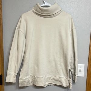 Cream colored athleta sweater. Size medium. Never worn.